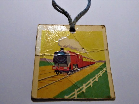 My coat rack label (age 5) featuring a steam train