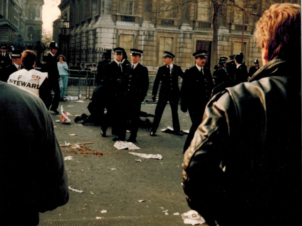 Police making arrests as the they guarded the gated entrance to Downing Street.