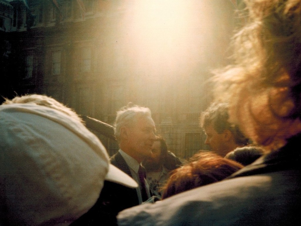 Tony Benn talking at Whitehall talking with demonstrators 